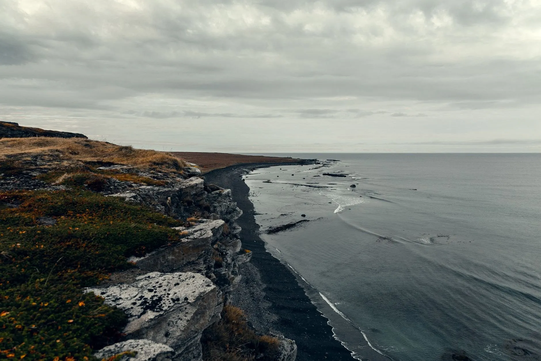 A black sand coastline from the cliff